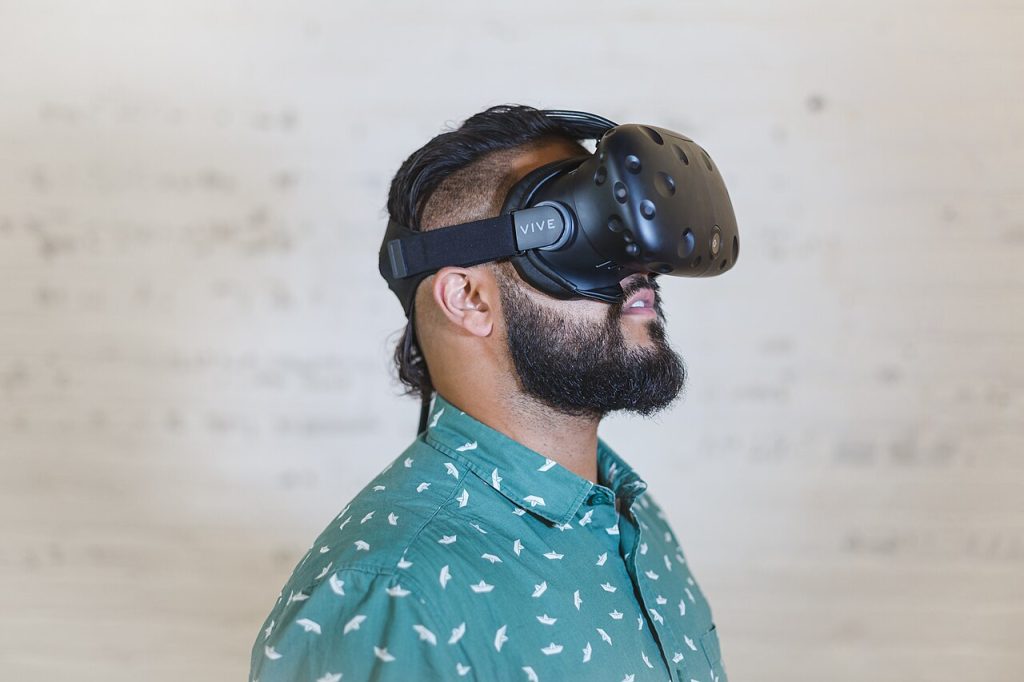 A man wearing an HTC Vive virtual reality headset