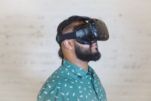 A man wearing an HTC Vive virtual reality headset
