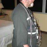 A sleep-study participant rests in bed while monitoring sensors record the night.